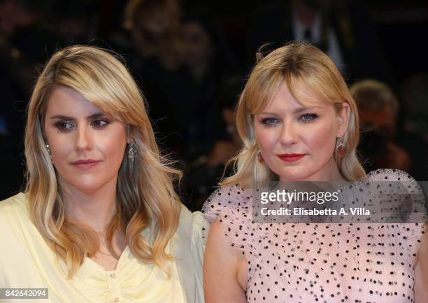 Kate Mulleavy and Kirsten Dunst walk the red carpet ahead of the 'Woodshock' screening during the 74th Venice Film Festival at Sala Giardino on...