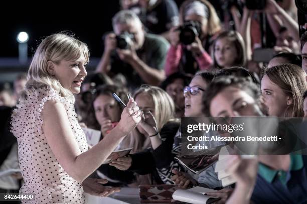 Kirsten Dunst walks the red carpet ahead of the 'TWoodshock' screening during the 74th Venice Film Festival at Sala Giardino on September 4, 2017 in...