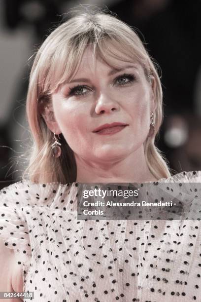 Kirsten Dunst walks the red carpet ahead of the 'TWoodshock' screening during the 74th Venice Film Festival at Sala Giardino on September 4, 2017 in...