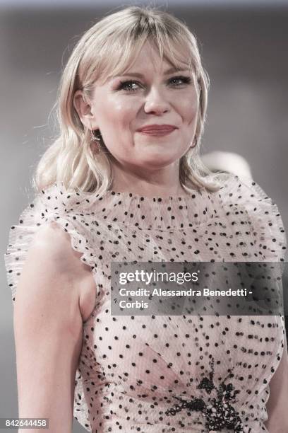 Kirsten Dunst walks the red carpet ahead of the 'TWoodshock' screening during the 74th Venice Film Festival at Sala Giardino on September 4, 2017 in...