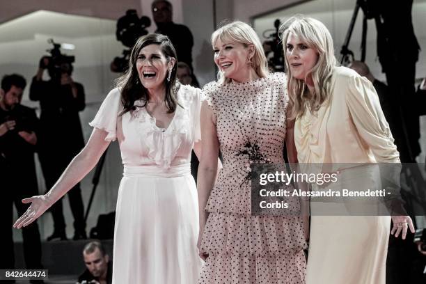 Kate Mulleavy, Kirsten Dunst and Laura Mulleavy walk the red carpet ahead of the 'TWoodshock' screening during the 74th Venice Film Festival at Sala...