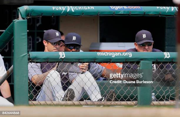 Manager Brad Ausmus of the Detroit Tigers and hitting coach Lloyd McClendon of the Detroit Tigers use an MLB iPad while watching the ninth inning of...