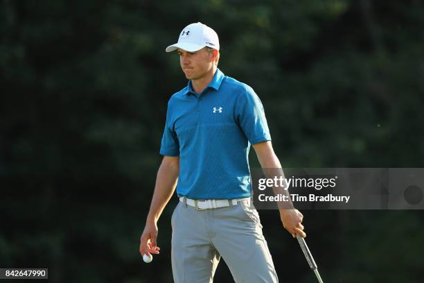 Jordan Spieth of the United States reacts after his bogey on the 18th green during the final round of the Dell Technologies Championship at TPC...