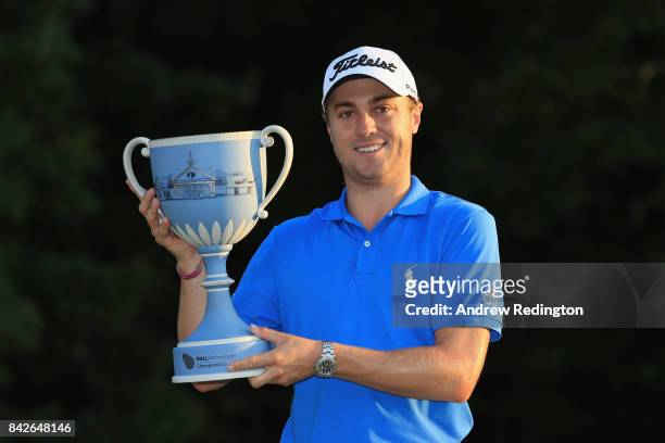 Justin Thomas of the United States poses with the trophy after winning the Dell Technologies Championship at TPC Boston on September 4, 2017 in...