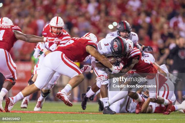 Arkansas State Red Wolves running back Jamal Jones runs up the middle during the second half against Nebraska linebacker Marcus Newby and defensive...