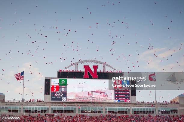 Nebraska Cornhusker fans release red balloons after the first score against the Arkansas State Red Wolves during the first half on September 02, 2017...