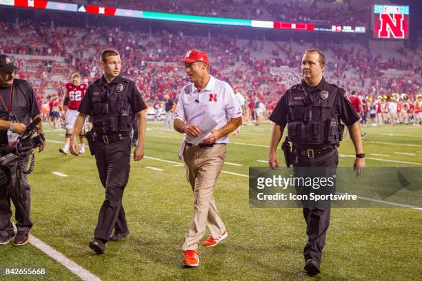 Nebraska head coach Mike Riley walks off the field after the game against the Arkansas State Red Wolves on September 02, 2017 at Memorial Stadium in...