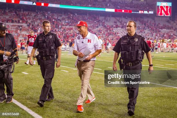 Nebraska head coach Mike Riley walks off the field after the game against the Arkansas State Red Wolves on September 02, 2017 at Memorial Stadium in...