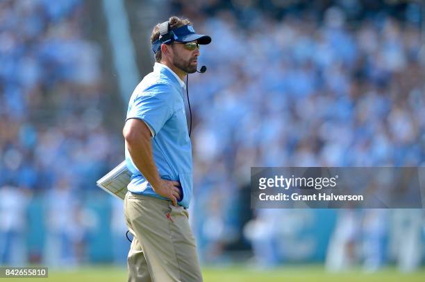Head coach Larry Fedora of the North Carolina Tar Heels watches during their game against the California Golden Bears at Kenan Stadium on September...