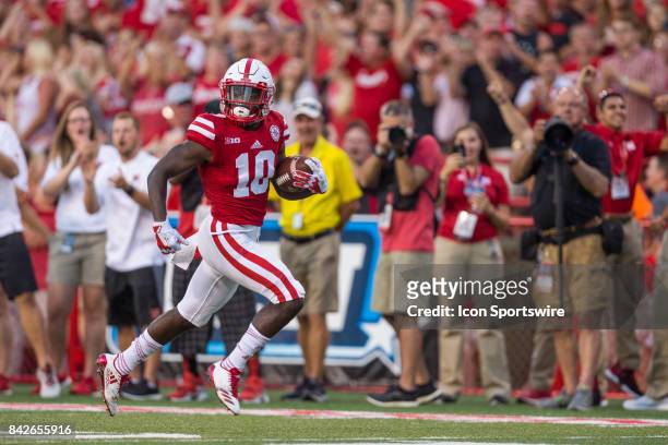 Nebraska wide receiver JD Spielman runs for at touchdown on a kick return during the first half against the Arkansas State Red Wolves on September...