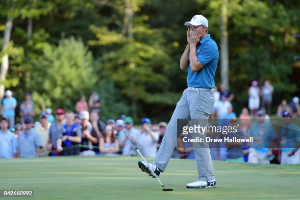 Jordan Spieth of the United States reacts after missing his putt for par on the 14th green during the final round of the Dell Technologies...