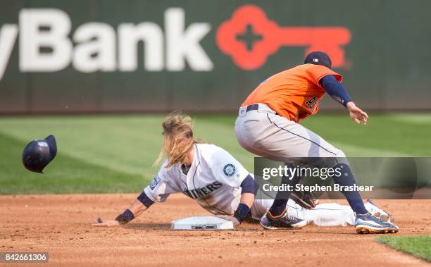 Taylor Motter of the Seattle Mariners steals second base before shortstop Carlos Correa of the Houston Astros can put on a tag during the second...