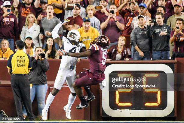 West Virginia Mountaineers cornerback Mike Daniels Jr. Is called for pass interference in the fourth quarter against Virginia Tech Hokies wide...