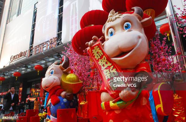 Ox shape toys stand in front of a store to mark the Lunar New Year on January 12, 2009 in Guangzhou, China. Chinese people are preparing for the...