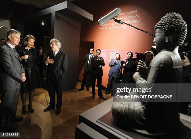 Belgium Prince Philippe, Princess Mathilde and Exhibition commissioner, Jan Van Alphen chat as they paid a visit to the exhibition 'Le sourire de...