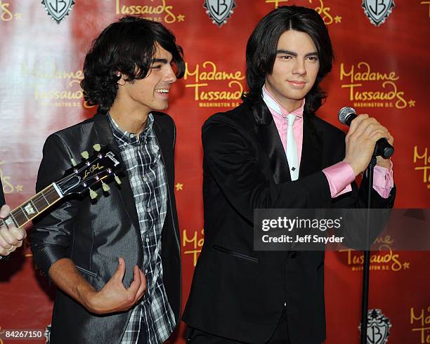 Kevin Jonas, Joe Jonas and Nick Jonas of The Jonas Brothers at the unveiling of wax figures at Madam Tussauds on August 18, 2008 in Washington, DC.