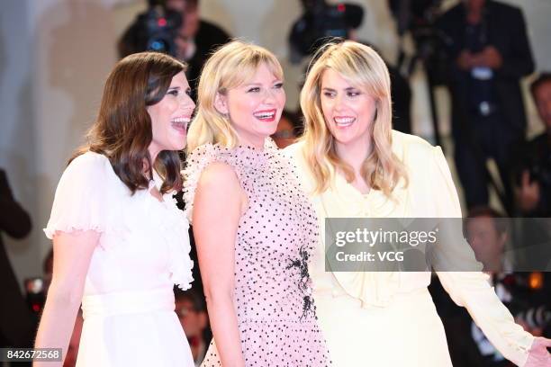 American fashion designer Laura Mulleavy, American actress Kirsten Dunst and American fashion designer Kate Mulleavy arrive at the red carpet of film...