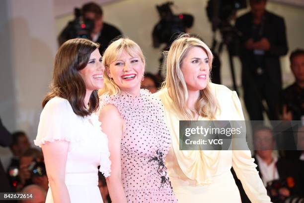 American fashion designer Laura Mulleavy, American actress Kirsten Dunst and American fashion designer Kate Mulleavy arrive at the red carpet of film...