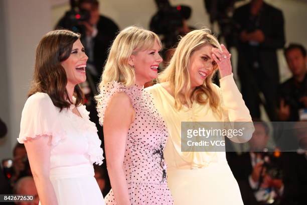 American fashion designer Laura Mulleavy, American actress Kirsten Dunst and American fashion designer Kate Mulleavy arrive at the red carpet of film...