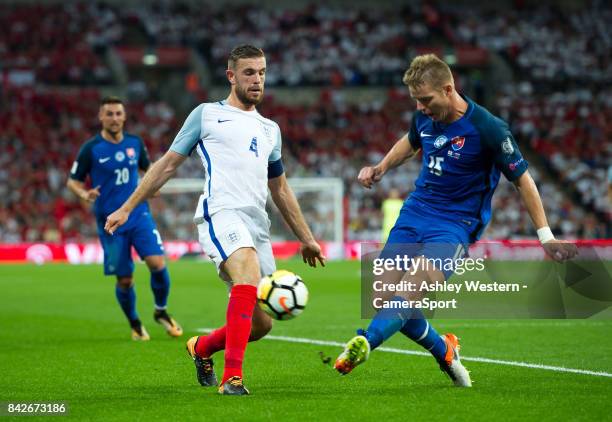 England's Jordan Henderson battles for possession with Slovakia's Tomas Hubocan during the FIFA 2018 World Cup Qualifier between England and Slovakia...