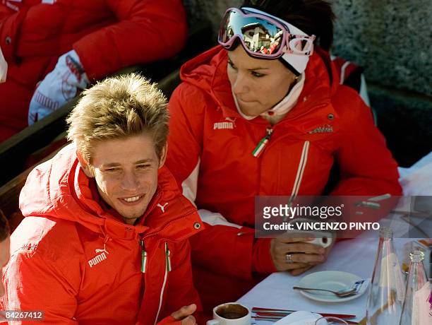 MotoGP Ducati driver Australian Casey Stoner takes a break with his wife Adriana prior skiing during the "Wrooom, F1 and MotoGP Press Ski Meeting"...