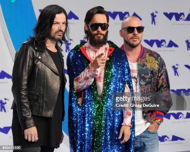 Tomo Milicevic, Jared Leto and Shannon Leto of 30 Seconds to Mars arrive at the 2017 MTV Video Music Awards at The Forum on August 27, 2017 in...