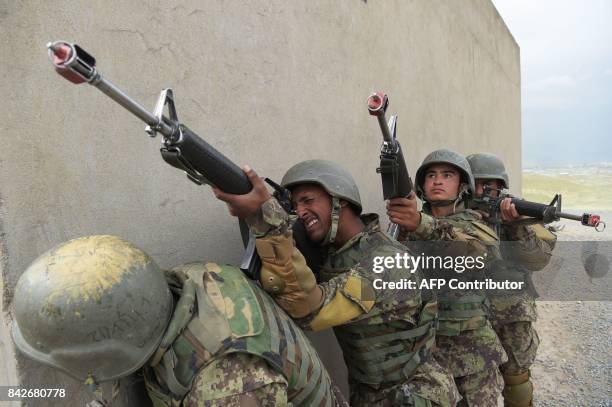In this photograph taken on May 3 Afghan National Army soldiers train at the Kabul Military training centre on the outskirts of Kabul. Fresh recruits...