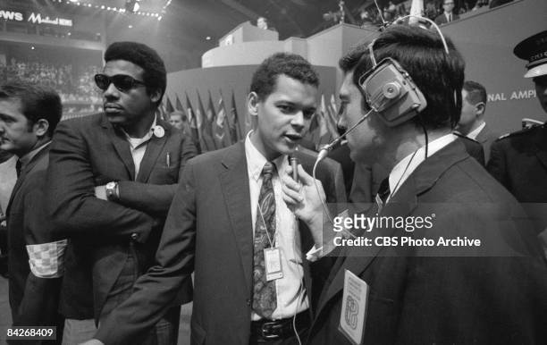 American politician Julian Bond , Congressman from Georgia and future head of the NAACP, answers questions from journalist Dan Rather on the floor at...