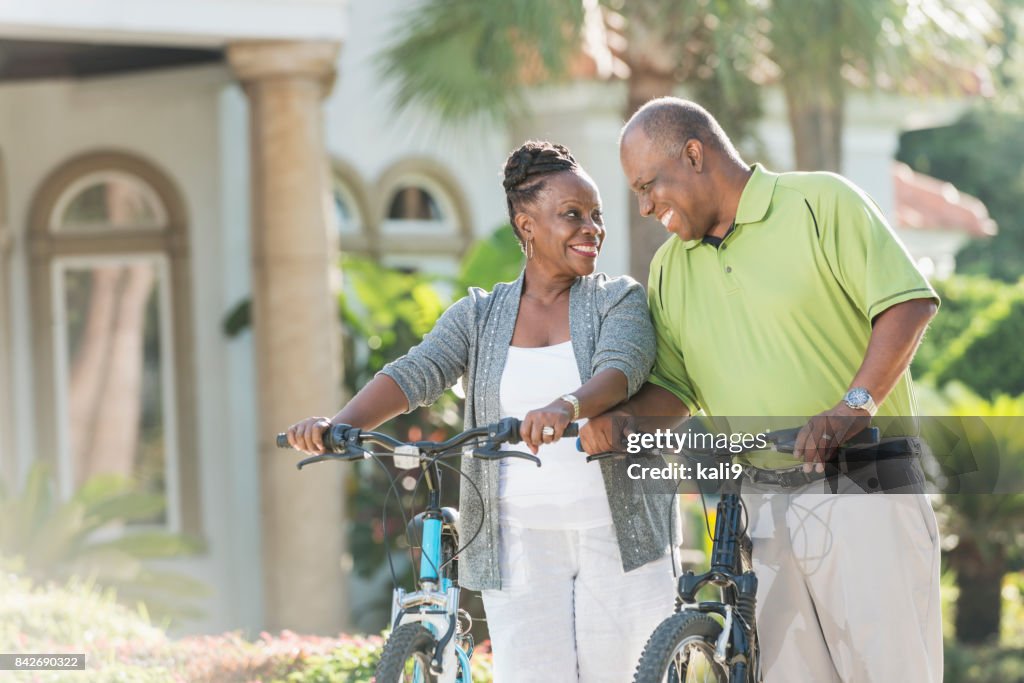 Senior African-American couple riding bicycles