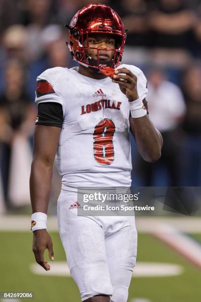 Louisville Cardinals quarterback Lamar Jackson looks to the sidelines during the college football game between the Purdue Boilermakers and Louisville...