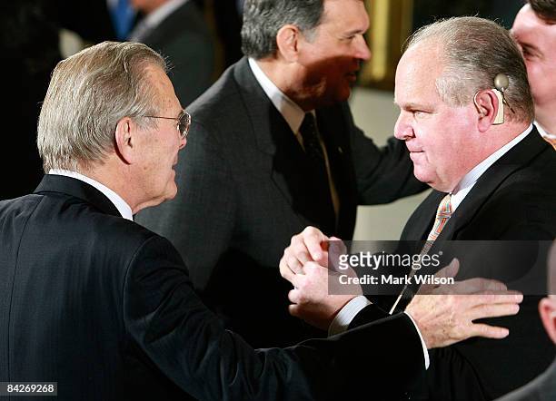 Former U.S. Secretary of Defense Donald Rumsfeld talks with radio talk show host Rush Limbaugh before the start of a Medal of Freedom ceremony at the...