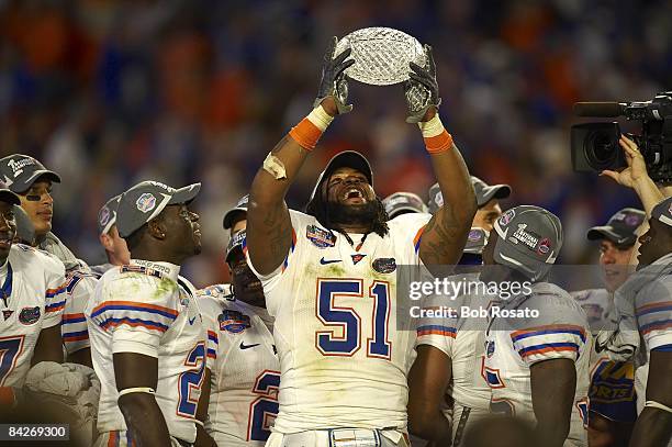 National Championship: Florida Brandon Spikes victorious with trophy after winning game vs Oklahoma. Miami, FL 1/8/2009 CREDIT: Bob Rosato