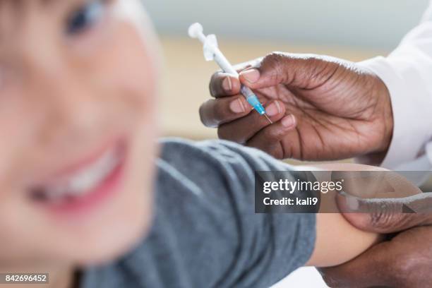 High Re Injection Closeup Of Doctor Giving Injection To Child High-Res Stock Photo ...
