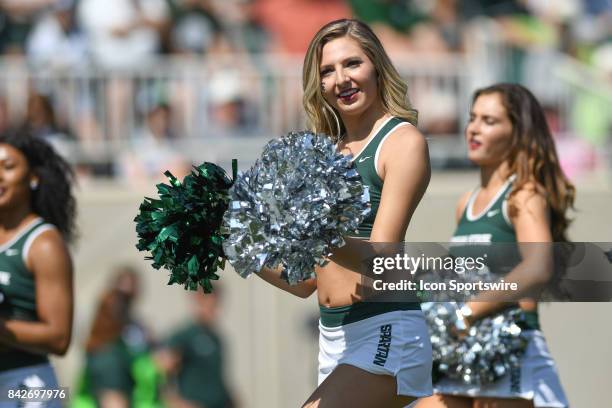 Member of the Spartan dance team cheers during a non-conference NCAA football game between Michigan State and Bowling Green on September 2 at Spartan...