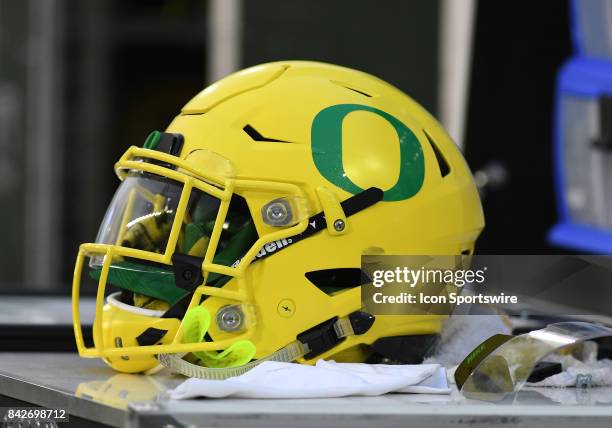 An Oregon Ducks helmet sits on an equipment box during a college football game between the Southern Utah Thunderbirds and Oregon Ducks on September 2...