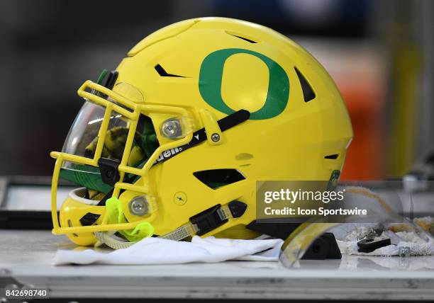 An Oregon Ducks helmet sits on an equipment box during a college football game between the Southern Utah Thunderbirds and Oregon Ducks on September 2...