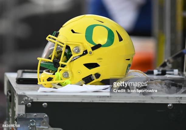 An Oregon Ducks helmet sits on an equipment box during a college football game between the Southern Utah Thunderbirds and Oregon Ducks on September 2...