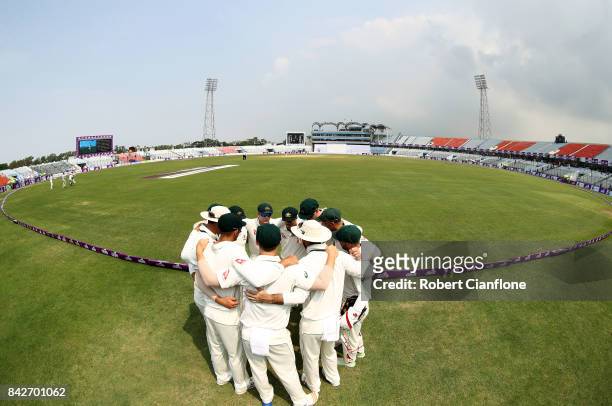 Steve Smith of Australia speaks to the players as they prepare to enter the field during day two of the Second Test match between Bangladesh and...