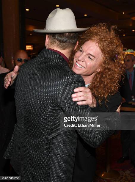 Singer/songwriter Matt Goss greets comedian Carrot Top as they arrive at a memorial for Jerry Lewis at the South Point Hotel & Casino on September 4,...