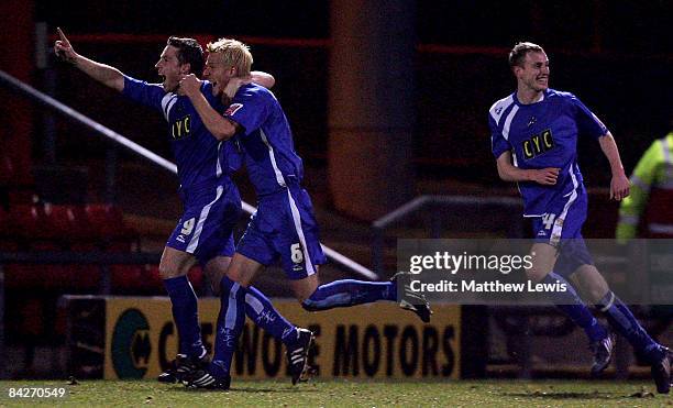 Zak Whitbread of Millwall is congratulated on his goal by Neil Harris during the FA Cup sponsored by E.on Third Round replay match between Crewe...