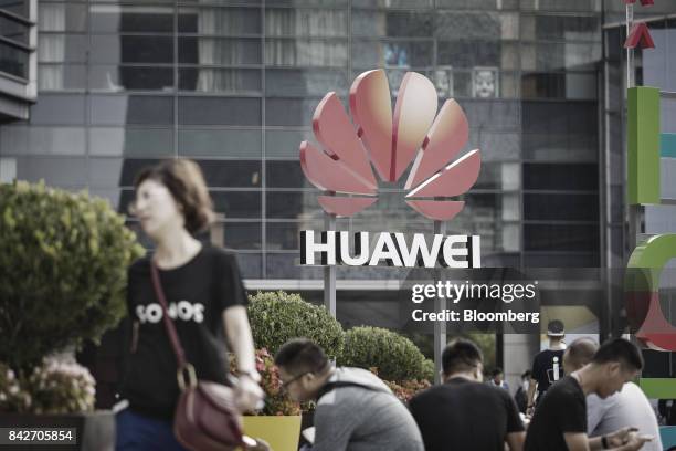 The Huawei Technologies Co. Logo is displayed outside the Huawei Connect 2017 conference in Shanghai, China, on Tuesday, Sept. 5, 2017. Huawei...