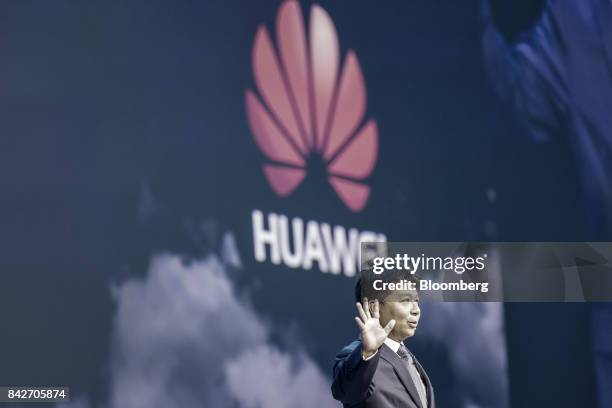 Guo Ping, rotating chief executive officer and deputy chairman of Huawei Technologies Co., gestures while speaking during a keynote address at the...