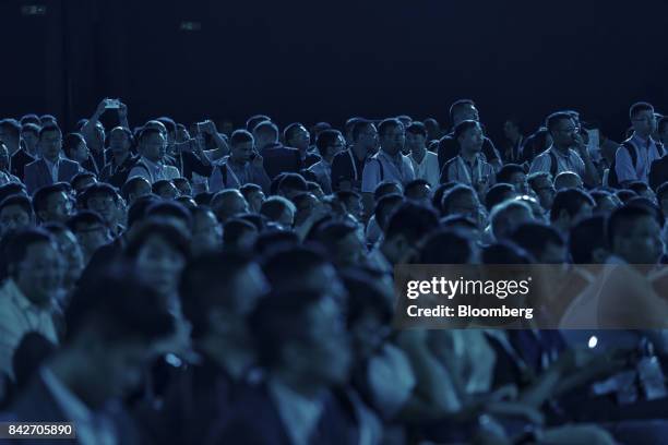 Attendees sit waiting for the keynote address at the Huawei Connect 2017 conference in Shanghai, China, on Tuesday, Sept. 5, 2017. Huawei...