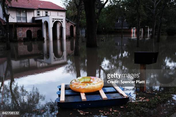 Homes remain flooded as Texas moved toward recovery from the devastation of Hurricane Harvey on September 4, 2017 in Houston, Texas. Almost a week...