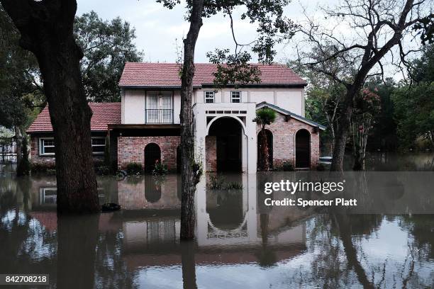 Homes remain flooded as Texas moved toward recovery from the devastation of Hurricane Harvey on September 4, 2017 in Houston, Texas. Almost a week...