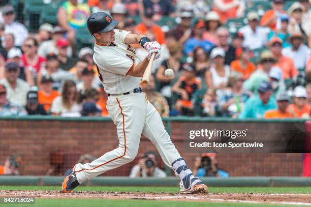 San Francisco Giants Catcher Buster Posey connects with the ball during a regular season game at the San Francisco Giants versus St. Louis Cardinals...