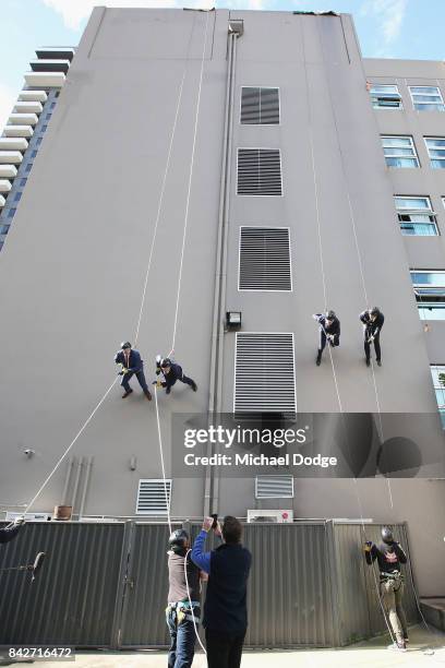 Fox Footy's David King and Dermott Brereton Jonathan Brown and Ben Dixon are seen scaling down during the Fox Footy Finals Launch on September 5,...