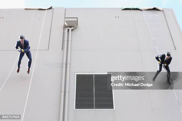 Fox Footy's David King and Ben Dixon are seen scaling down during the Fox Footy Finals Launch on September 5, 2017 in Melbourne, Australia. FOX...