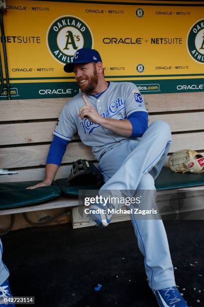 Brandon Moss of the Kansas City Royals sits in the dugout prior to the game against the Oakland Athletics at the Oakland Alameda Coliseum on August...