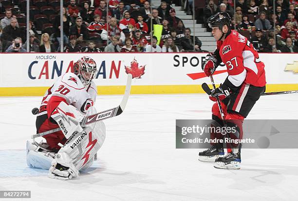 Dean McAmmond of the Ottawa Senators shoots the puck past Cam Ward of the Carolina Hurricanes for the score at Scotiabank Place on January 13, 2009...